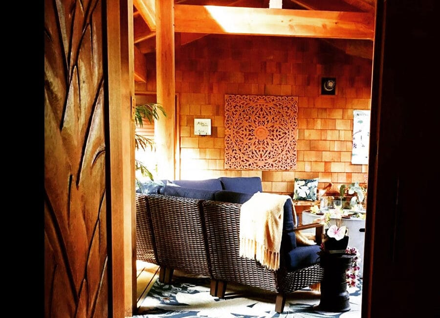 door opening to the At the Crater's Edge entryway with blue patio furniture