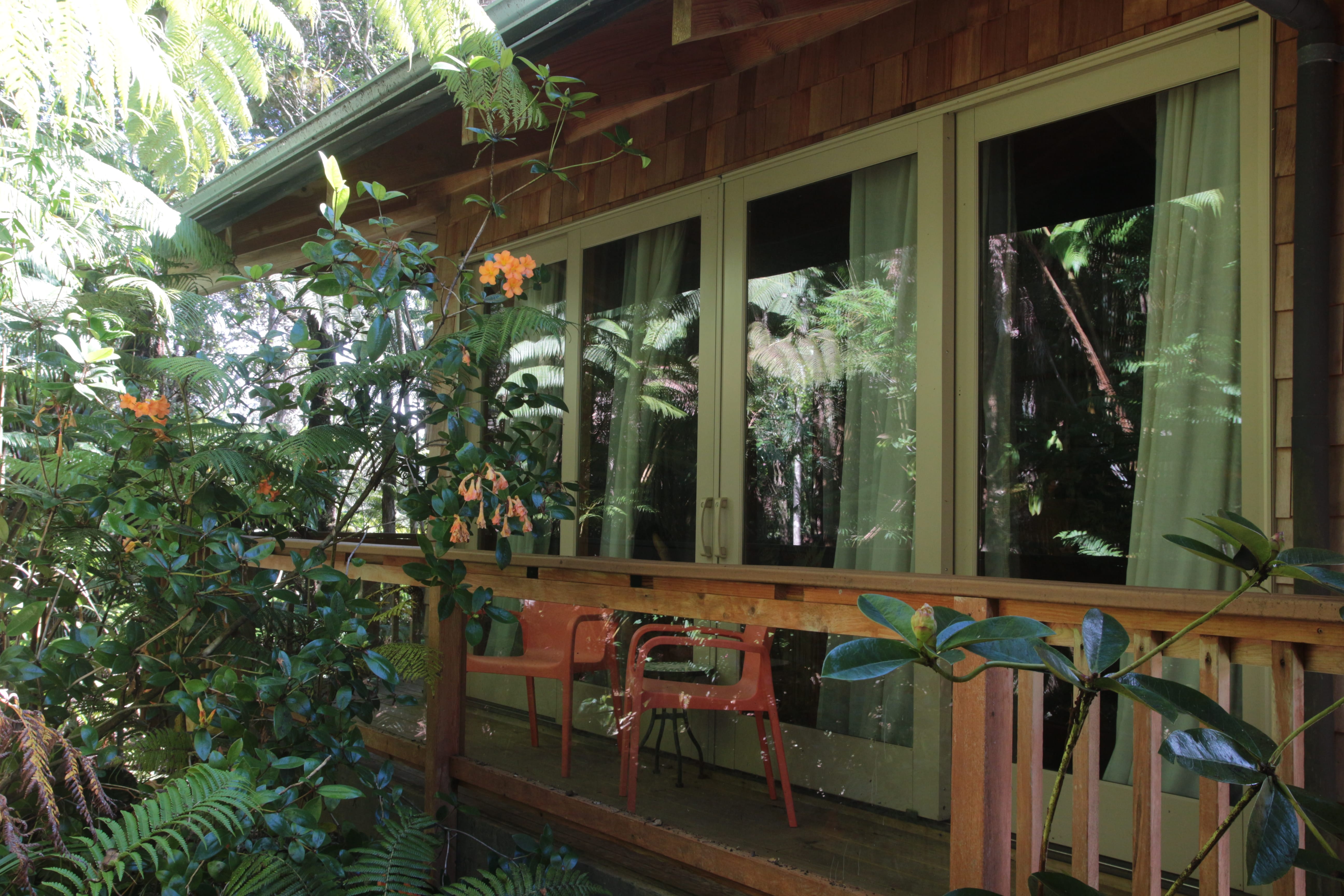 private lanai outside of Haiku Garden with two red chairs